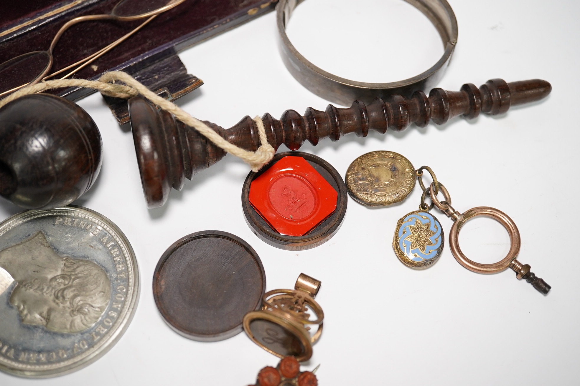 A group of various oddities to include a miser's purse, a lignum vitae ball and cup game, a mourning brooch, spectacles etc. Condition - varies